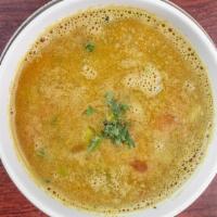 Daal Soup · Dairy free, gluten free. Yellow lentil, garlic, cumin, fresh tomato, onion and cilantro in s...