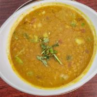 Dal Tadka · Gluten free. Yellow lentil cooked with cumin, onion, cilantro and fresh tomato.