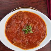 Lamb Vindaloo · Gluten free. Boneless lamb pieces and potatoes cooked in onion and tomato based spicy vinega...