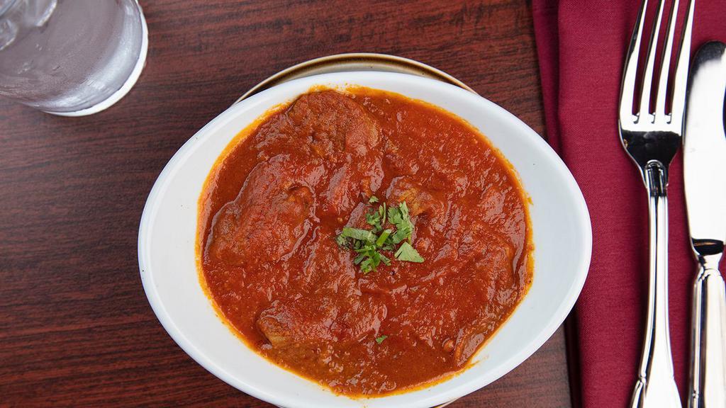Lamb Vindaloo · Gluten free. Boneless lamb pieces and potatoes cooked in onion and tomato based spicy vinegary sauce.