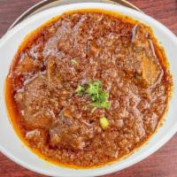 Goat Curry · Gluten free. Bone-in goat meat cooked with traditional curry sauce.
