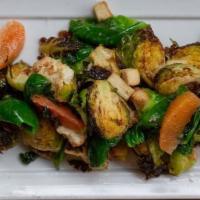Warm Brussels Sprouts · Gluten-free. Cauliflower, seasonal fruit, house tofu croutons and Thai vinaigrette. Contains...