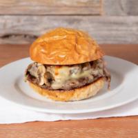 Bbq Burger · Grass-fed burger topped with swiss cheese, grilled mushrooms and onions, and bbq sauce. Serv...