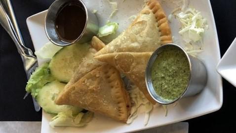 Meat Samosa · Crisp pastry filled with ground lamb, peas and spices, and deep-fried.