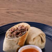 Carne Asada Burritos · 12” Flour Tortilla with Cilantro lime rice, Onions, Cilantro, Arbol Salsa, Black Beans, Mexi...