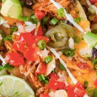 Loaded Nachos · Chips Topped with Pepper Jack Cheese, Jalapenos, Pico, Crema, Black Beans