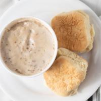 Biscuits & Gravy · Two biscuits draped in country sausage gravy. Served with hash browns.