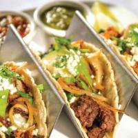 (3) Tacos Plazeros · 3 Corn tortilla tacos filled with your choice of beef fajita, chicken fajita, carnitas or br...