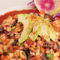 Ceviche Vip · Poached shrimp, octopus, cucumber, tomato, onion, cilantro, homemade salsa negra, and avocado.