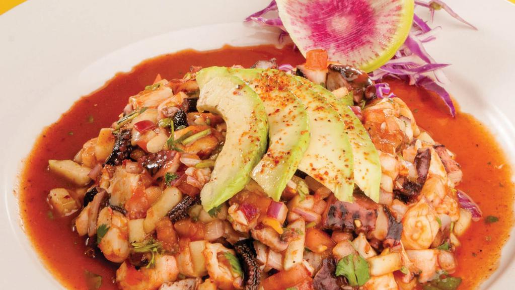 Ceviche Vip · Poached shrimp, octopus, cucumber, tomato, onion, cilantro, homemade salsa negra, and avocado.