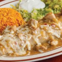 Smothered Burrito · Filled with beans and cheese. Smothered with chile verde. Served with rice, guacamole, and s...