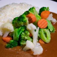 Vegetable Curry · Steamed broccoli, cauliflower, carrots and squash served with rice and curry.