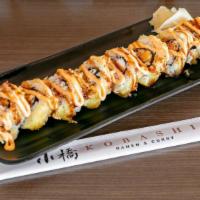 Signature Kobashi Roll · Deep-fried sushi roll filled with crab meat and cream cheese. Topped with eel sauce and chip...