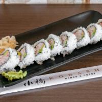 California Roll · Sushi roll filled with crab meat and avocado.