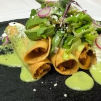 Flautas De Pollo · 5 Deep-fried tortillas rolled with chicken, topped with guacamole sauce, lettuce, tomato, so...