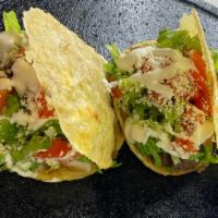 Gorditas · Corn tortilla stuffed with beans, onion, lettuce, tomato, and your choice of meat with cotij...