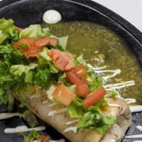 Wet Burrito · Served with rice, whole beans, cheese, onion, cilantro topped with green tomatillo sauce,  t...