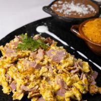 Huevos Con Jamón  · Eggs with ham served with rice, beans and corn or flour tortillas