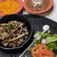 Carnitas Plate  · Fried Pork Carnitas, fried chile serrano, served with rice, beans and salad with corn or flo...