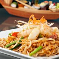Pad Thai Noodles · Springy, thin rice noodles stir-fried with a sweet and savory tamarind sauce, egg, garlic, t...