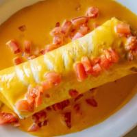 Queso Dip Burrito · Finally here! your choice of chicken or ground beef with rice and beans wrapped in a flour s...