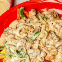 Pollo Con Crema · Tender chicken strips cooked  in an authentic mexican sour cream sauce with green peppers, o...