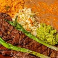 Carne Asada · Skirt steak butterflied and flame broiled to your liking. Served with  guacamole.