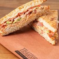 Turkey Avocado · Ovengold roasted turkey, picante provolone cheese, avocado, red onions, tomatoes, and Calabr...