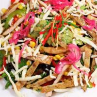 Chile Amor Salad · mixed greens, red onion, bell pepper, olives, corn, cheese, crunchy tortilla strips, and dre...
