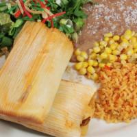 Tamales · (2) tamales of your choice, rice, beans, salad, and sour cream.