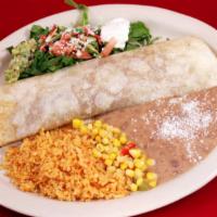Burrito · monterey jack cheese, rice, beans, guacamole, salad, corn salad, sour cream.