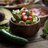Traditional Guacamole · Crushed Hass avocados, cilantro, lime, onion and serrano chiles.  Comes with our house made ...