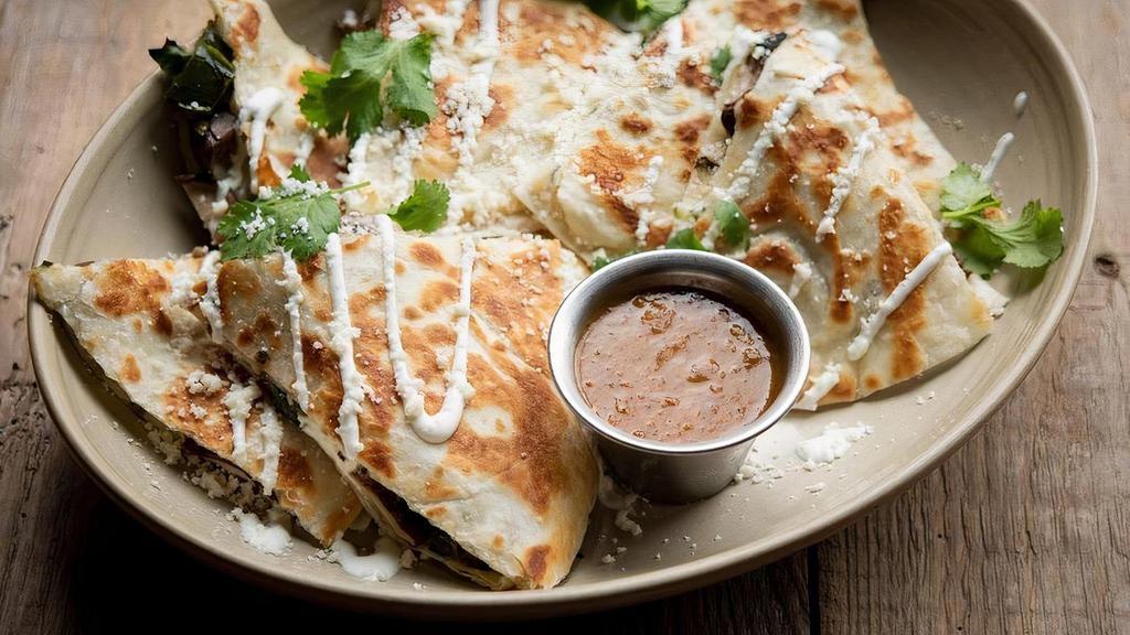 Roasted Corn Quesadilla (Small) · Cilantro, red onion, jalapeño, Jack and white cheddar cheeses, buttermilk. crema, tomatillo salsa.  NOTE:  A larger version of this is avaialble under the 