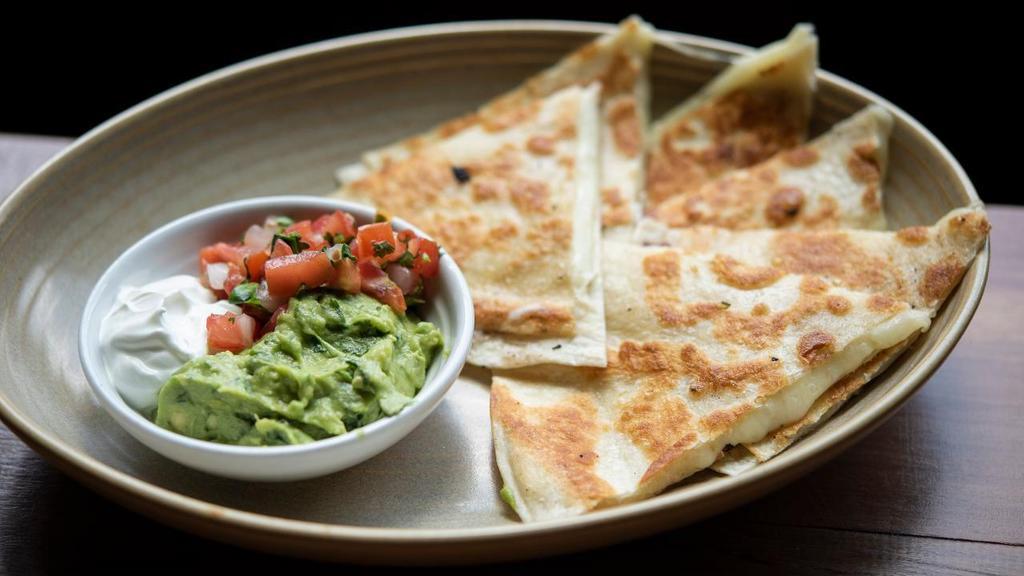 Cheese Quesadilla (Large) · With guacamole, pico de gallo, sour cream.  . We charge 20% more for items on ALL third party delivery sites to cover the commission they charge us.  If you want to avoid this premium, we invite you to order for delivery or take-out . at www.CactusRestaurants.com.