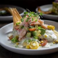 Red Crab Tamales · Sweet corn tamales, red crab, sherry tomatillo cream sauce, avocado, mixed baby heirloom tom...