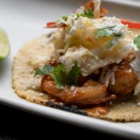 1 Taco Camarones · Crispy prawns, spicy diablo sauce, ginger and mango slaw, cilantro, buttermilk crema.