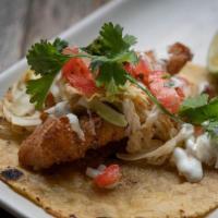 1 Taco Baja Fish · Crispy market fresh fish, coriander-pasilla slaw, pico de gallo, buttermilk crema.
