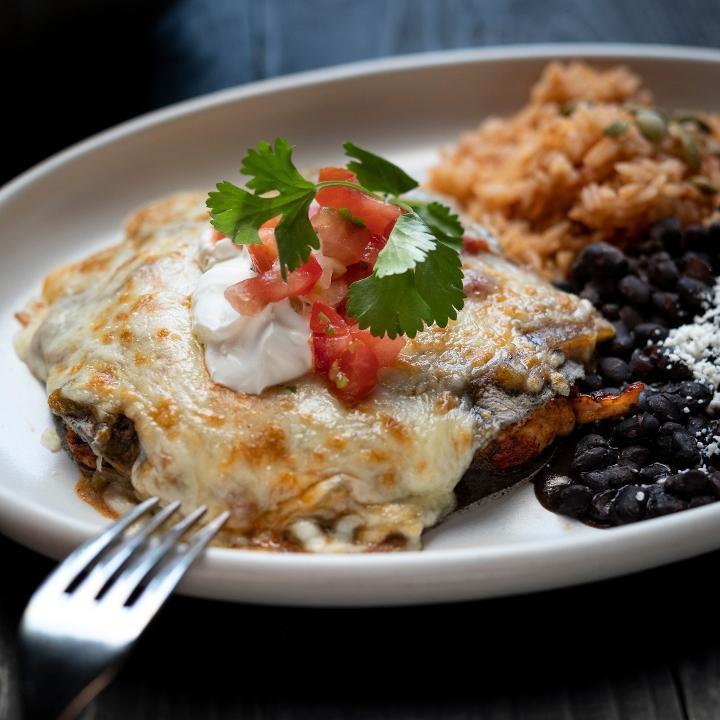 Chimayo Enchilada · Blue corn tortillas, chicken, housemade chorizo, spicy green chile sauce, jack cheese, sour cream, pico de gallo. . We charge 20% more for items on ALL third party delivery sites to cover the commission they charge us.  If you want to avoid this premium, we invite you to order for delivery or take-out . at www.CactusRestaurants.com.