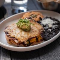 Squash Enchilada · Crisp white corn tortillas, jack cheese, goat cheese, sautéed spinach, roasted butternut squ...