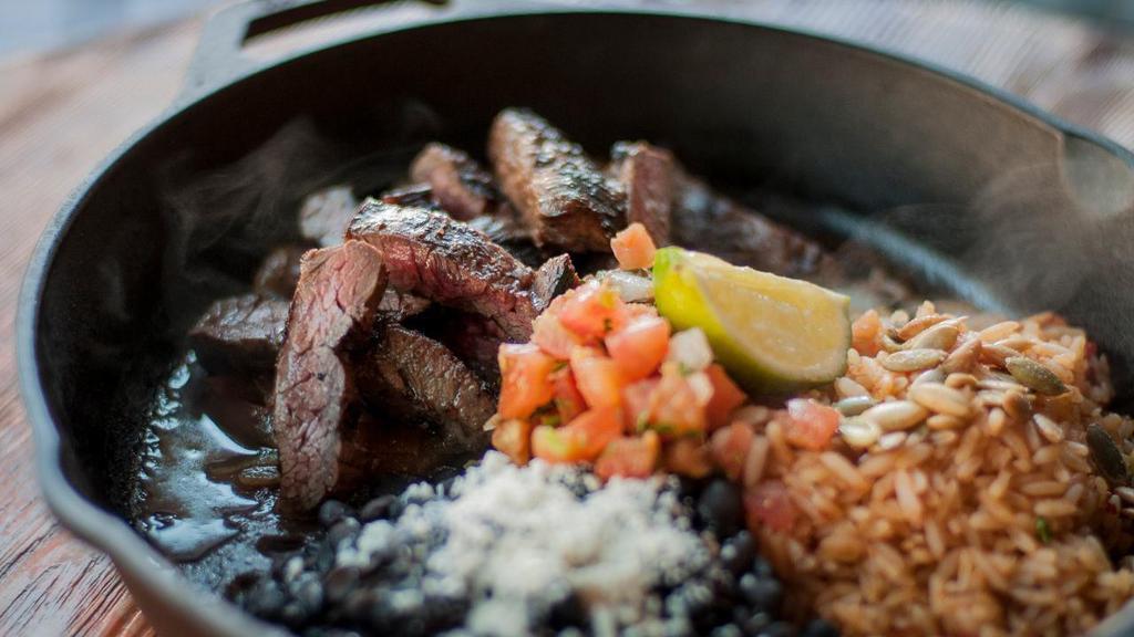 Steak Fajitas · All natural, hormone free skirt steak served with Spanish rice, cumin black beans and caramelized onions. Also includes fresh guacamole, sour cream, jack cheese, lettuce, pico de gallo and choice of flour or housemade corn tortillas on the side. . We charge 20% more for items on ALL third party delivery sites to cover the commission they charge us.  If you want to avoid this premium, we invite you to order for delivery or take-out . at www.CactusRestaurants.com.