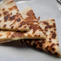 Kids Quesadilla · Flour tortilla, melted cheese.