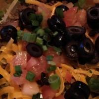 Taco Salad · It's a Fiesta time! Ground beef, shredded cheddar cheese, fresh diced tomatoes, black olives...