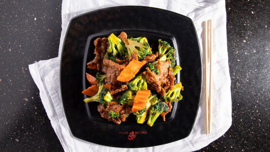 Broccoli Beef · Sliced beef steak sautéed with fresh broccoli and carrots in a dark seasoned sauce.