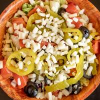 Garden Salad · Mixed greens, tomatoes, onions, cheese, banana peppers, olives.