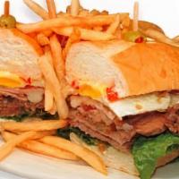 Lomito Completo · Steak, fried egg, provolone cheese, ham, tomatoes, lettuce, mayonnaise, and toasted baguette...