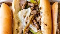 Philly Cheesesteak With Ff · Thin sliced beef, onions, and peppers provolone cheese served on a hoagie roll.