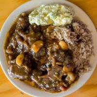 Beef Oxtails Stew · Oxtails simmered in a savory brown gravy, with butter beans and carrots.