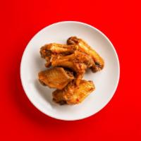 Spicy Wings · 6 crispy and fried spicy chicken wings.