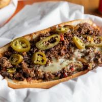 Tres’ Caliente · Spicy. 8 oz Shaved Seasoned Steak,  Grilled Onions, Jalapeño, ,Red Peppers, Spicy Seasoning,...