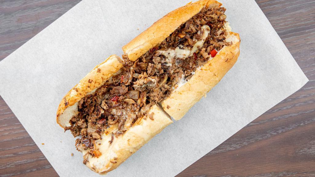 Pepper Cheesesteak · 8 oz Shaved Seasoned Steak, Grilled Onion, Red Peppers, White American Cheese and Mayo